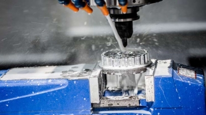 A CNC machine tool head in action